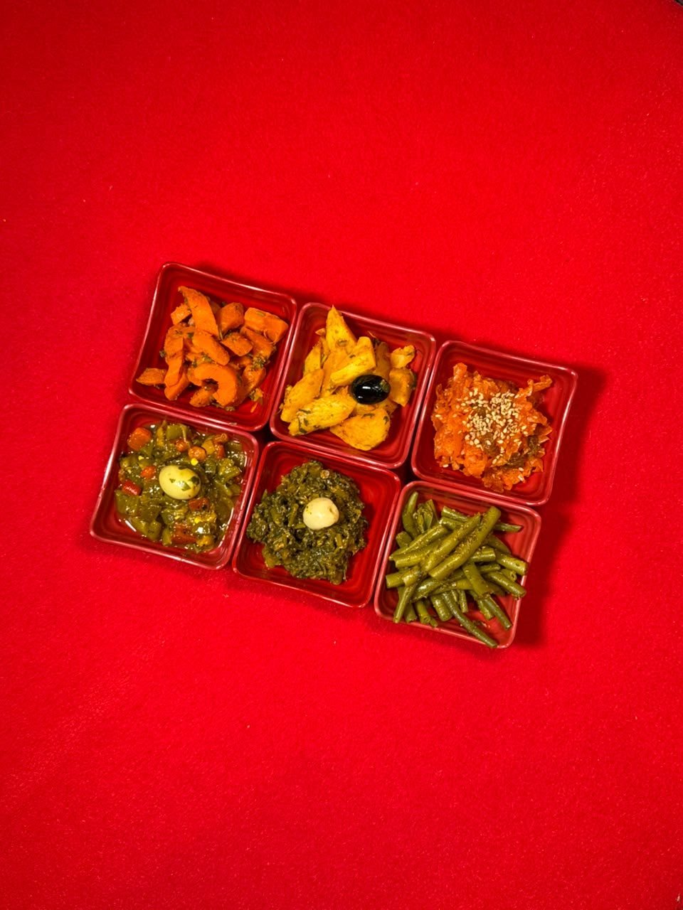 An assortment of Moroccan salads served in six small dishes