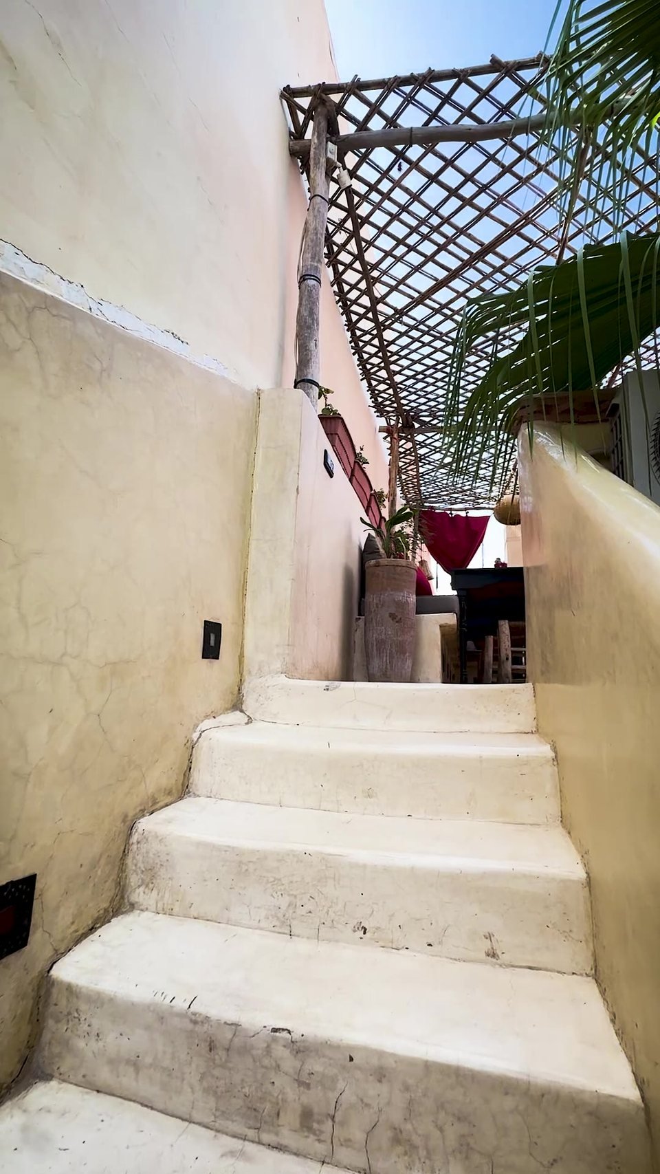 The whitewashed staircase climbing to the rooftop terrace